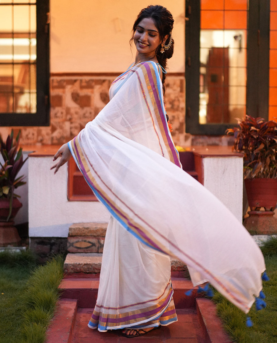 Cream Khadi Mul Cotton Saree, Complemented by a Contrast Multi-Colored Zari Striped Border, and a Matching Blouse
