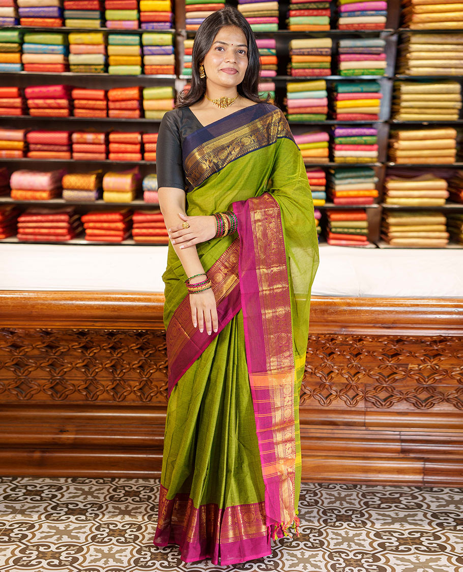 Green Plain Chettinad Cotton Saree, Complemented By Contrast Kal Eragina Traditional Zari Designs Woven Border, Subtly Striped Pallu, and Paired with a Matching Blouse