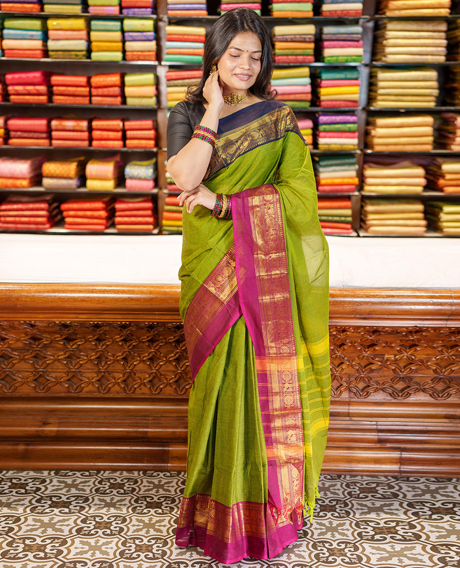 Green Plain Chettinad Cotton Saree, Complemented By Contrast Kal Eragina Traditional Zari Designs Woven Border, Subtly Striped Pallu, and Paired with a Matching Blouse