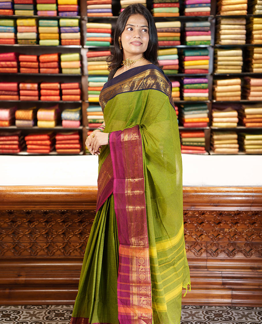 Green Plain Chettinad Cotton Saree, Complemented By Contrast Kal Eragina Traditional Zari Designs Woven Border, Subtly Striped Pallu, and Paired with a Matching Blouse
