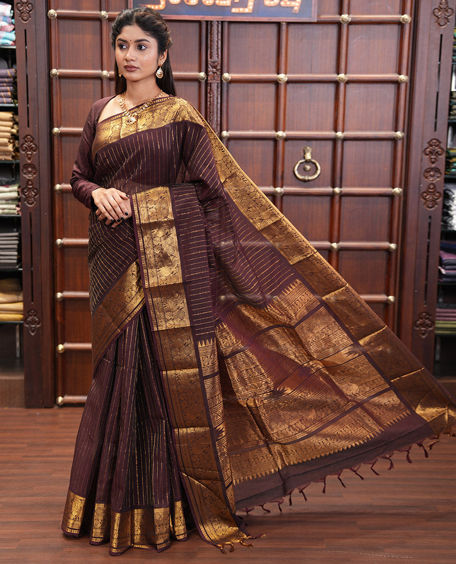 Brown Chettinad Cotton Saree, Spotlighted with Zari Stripes, Traditional Peacock-Chakram Border, Traditional Pallu, and a Matching Blouse