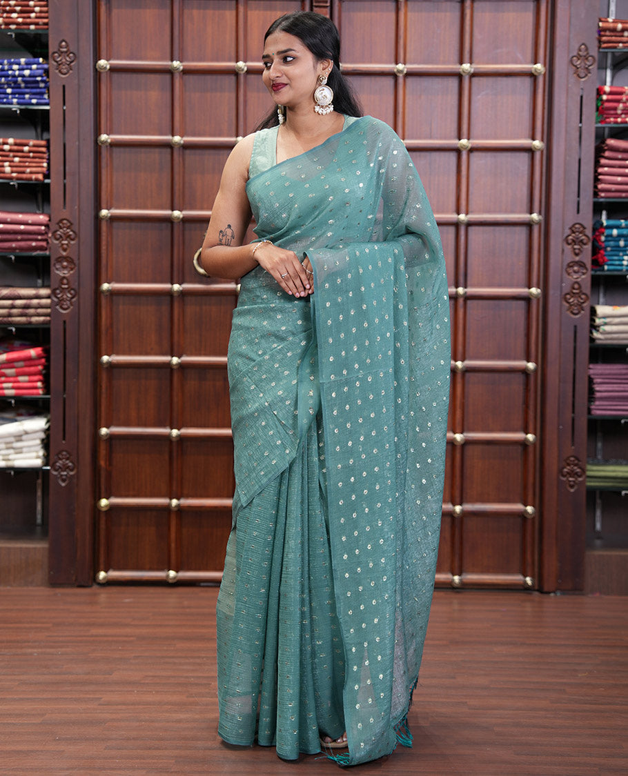 Borderless Blue Shimmer Saree, Subtly Sparkled with Zari Buttas All Over Its Body, Pallu Mirrors the Same Buttas, and Comes Without a Blouse