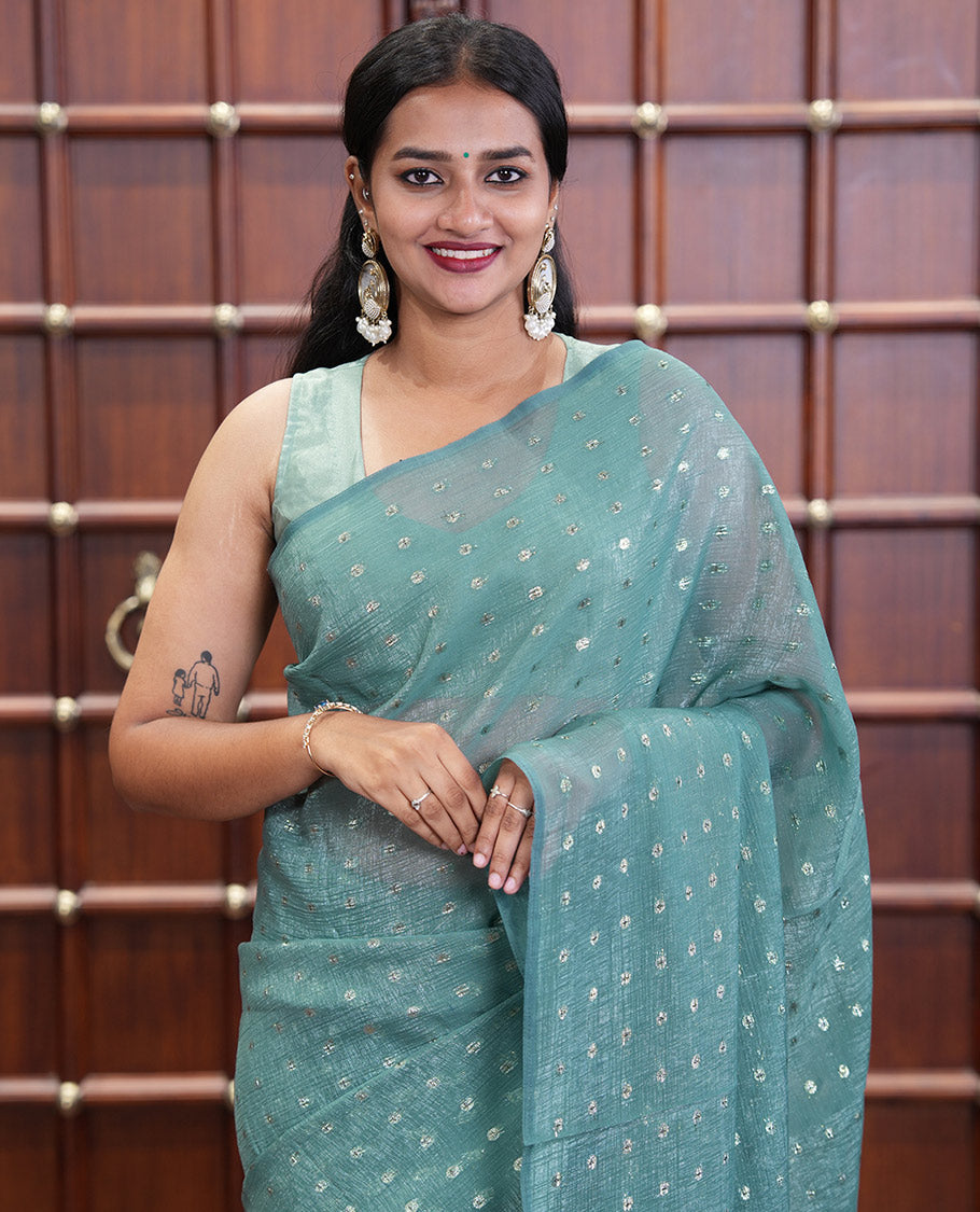 Borderless Blue Shimmer Saree, Subtly Sparkled with Zari Buttas All Over Its Body, Pallu Mirrors the Same Buttas, and Comes Without a Blouse