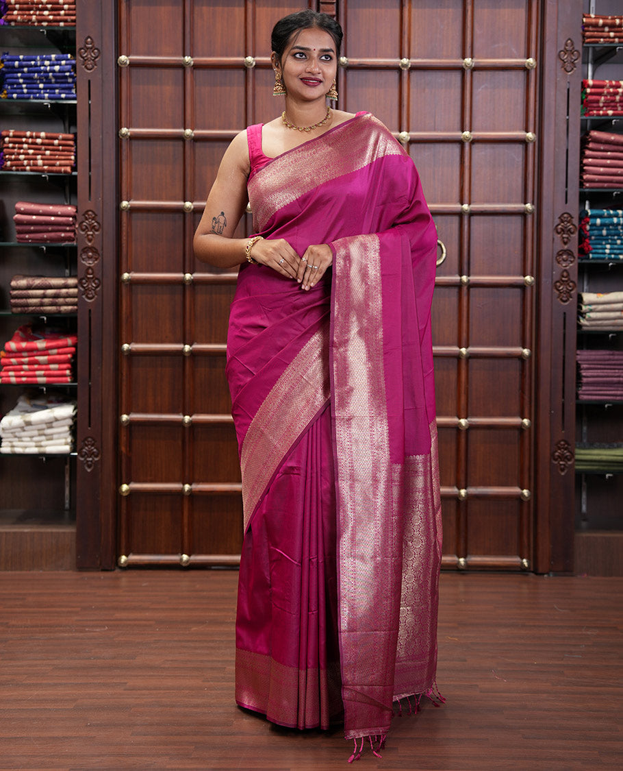 Pink Plain Semi-Soft Silk Saree, Elevated with Traditional Zari Designs Woven Border, Grandly Woven Pallu Steeped with Chakram Designs, and Paired with a Matching Blouse