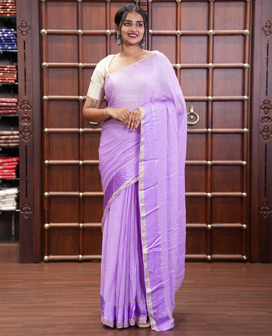 Scintillating Lavender Viscose Georgette Saree Gleamed Up with Checked Design on Its Body, Highlighted by a Double-Pet Border, Zari Checked Design Pallu, and Paired with a Matching Blouse