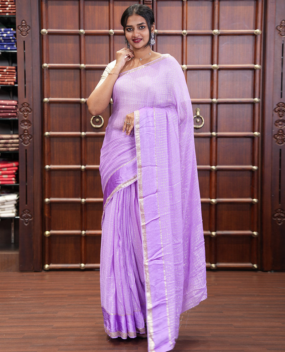 Scintillating Lavender Viscose Georgette Saree Gleamed Up with Checked Design on Its Body, Highlighted by a Double-Pet Border, Zari Checked Design Pallu, and Paired with a Matching Blouse