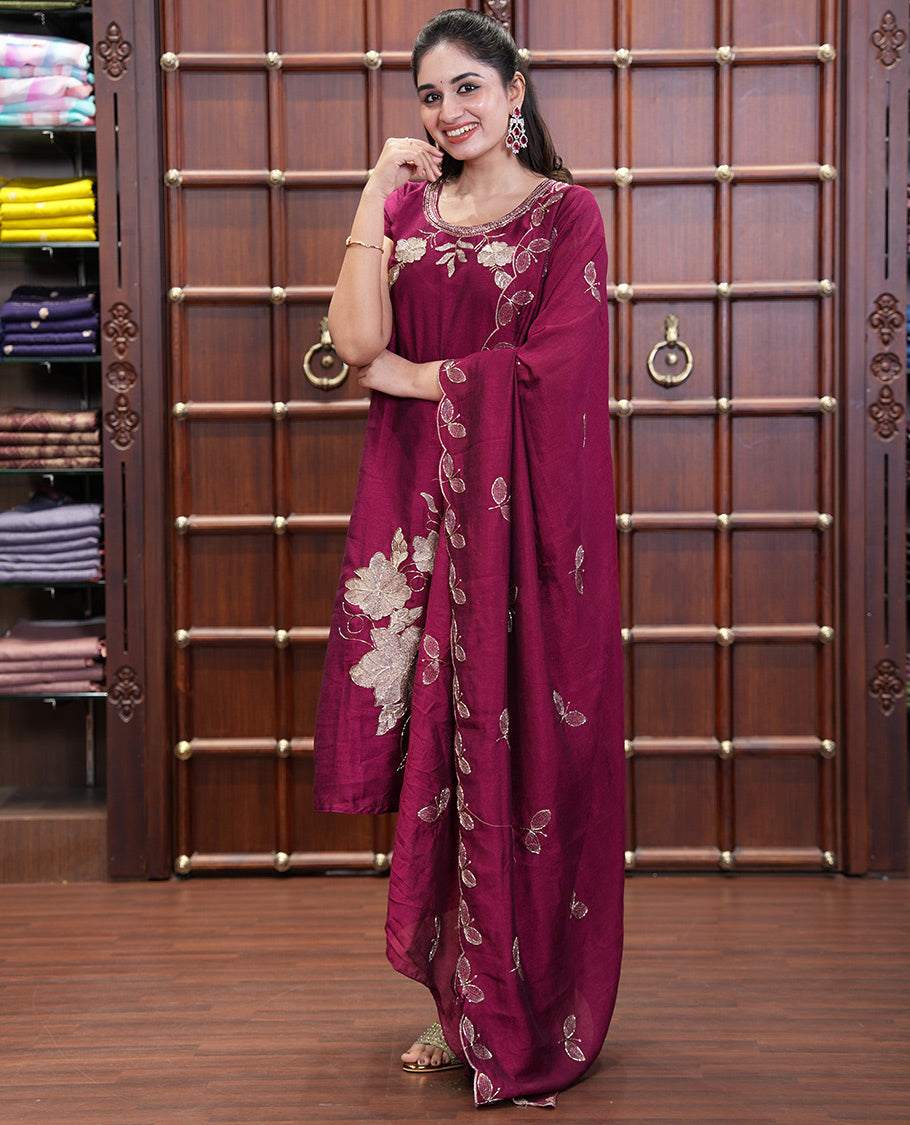 Wine Material Chudidhar Set, Highlighted with an Floral Motifs Embroidered on its Vichitra Silk Top, Plain Santoon Bottom, and Vichitra Silk Dupatta of Leaf Motifs Embroidery