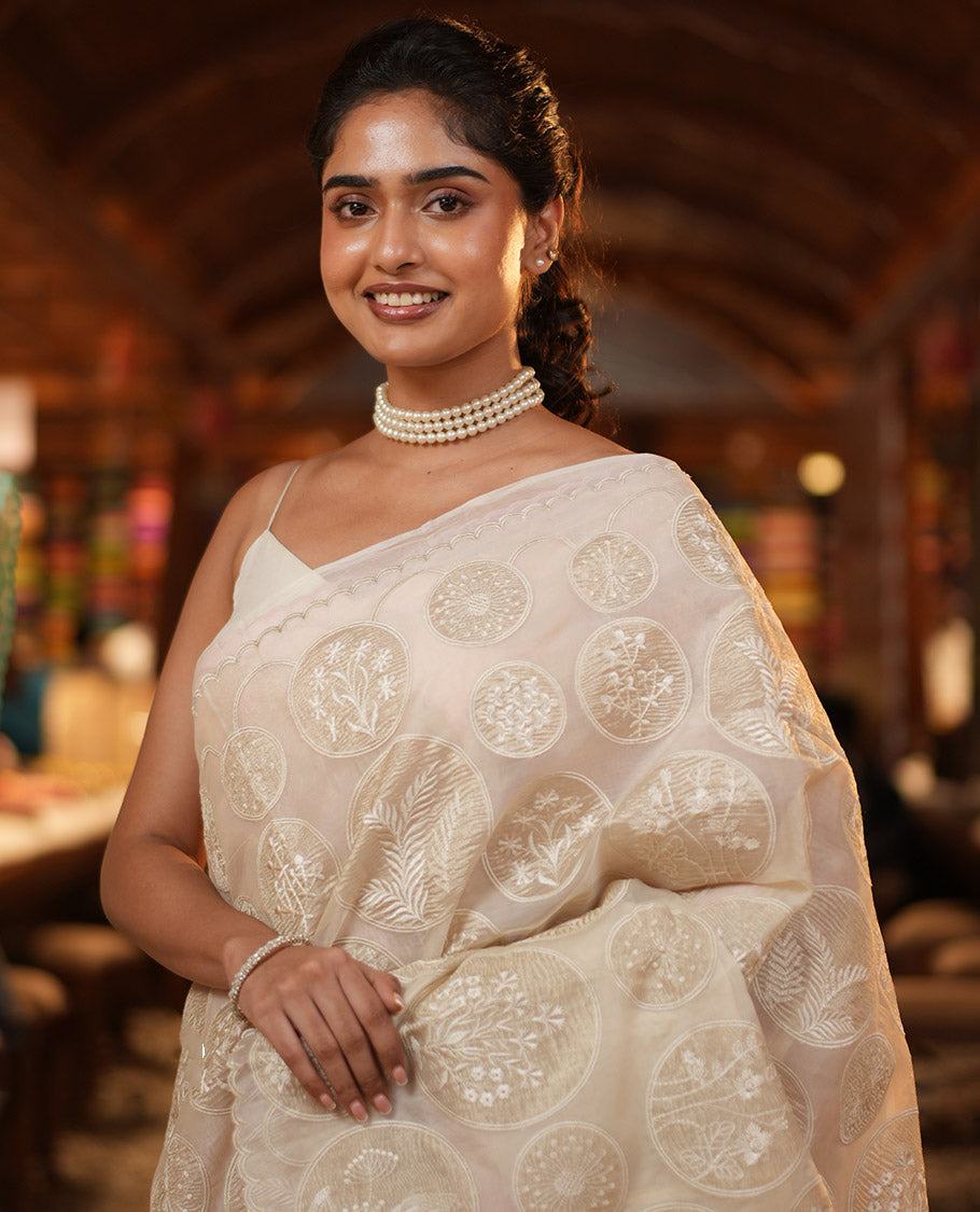 Off-White Organza Saree, Delicately decked Up with Floral Enclosed Circle Motifs Thread Embroidery, Subtle Scallop Border, Delicately Embroidered Pallu, and Paired with a Matching Embroidered Blouse