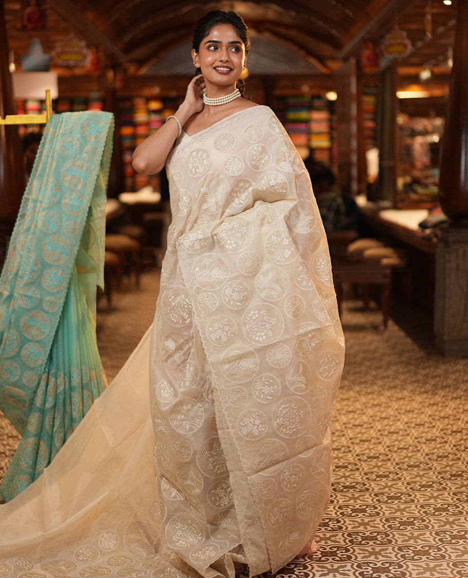 Off-White Organza Saree, Delicately decked Up with Floral Enclosed Circle Motifs Thread Embroidery, Subtle Scallop Border, Delicately Embroidered Pallu, and Paired with a Matching Embroidered Blouse