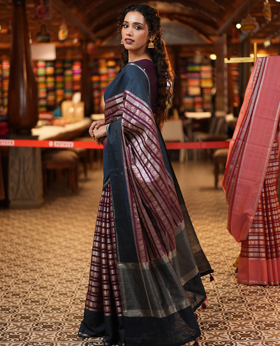 Wine Organza Saree, Richly Zari Detailed with Geometric and Elephant Motifs All Over Its Body, Complemented by Captivating Contrast Zari Border, Zari Decked Up Pallu, and Paired with a Contrast Blouse