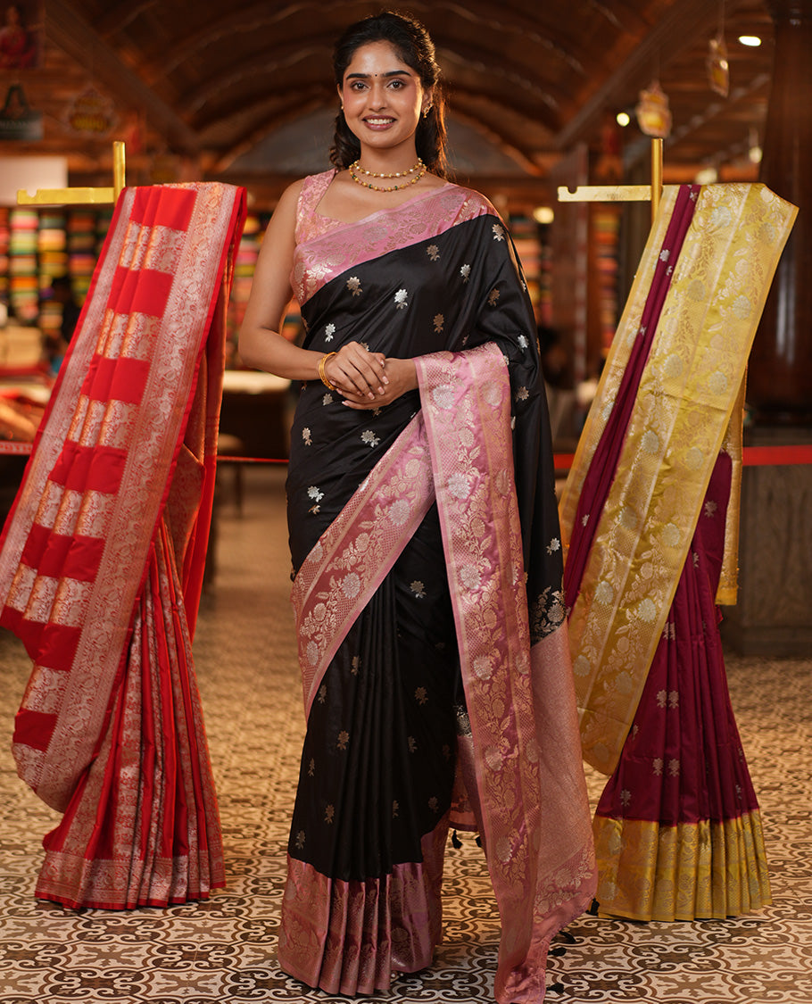 Black Mushuru Silk Saree, Adorned with Zari Buttas All Over Its Body, Complemented by Captivating Contrast Border of Floral Jaal Designs, Grandly Decked Up Pallu and Paired with a Contrast Blouse