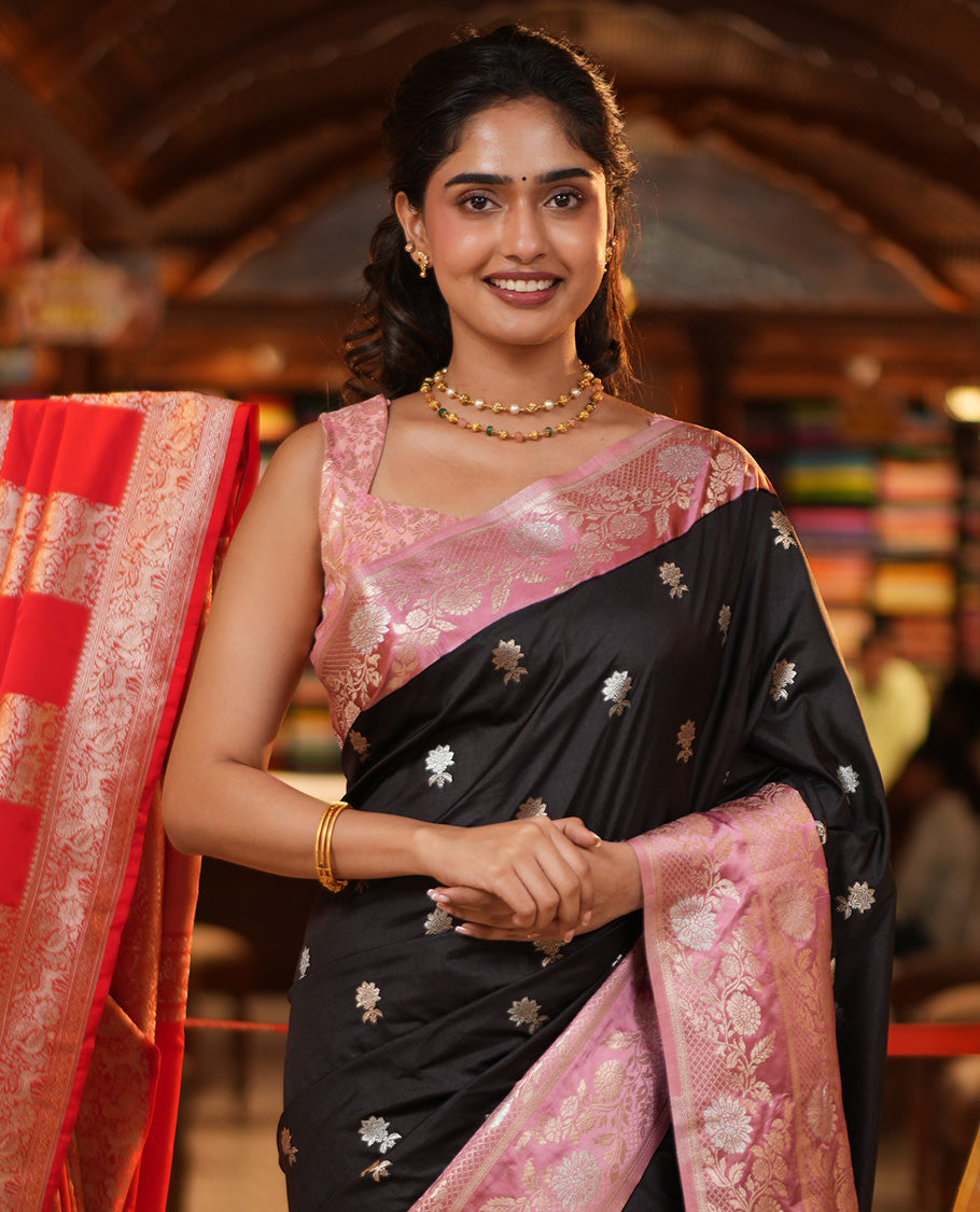 Black Mushuru Silk Saree, Adorned with Zari Buttas All Over Its Body, Complemented by Captivating Contrast Border of Floral Jaal Designs, Grandly Decked Up Pallu and Paired with a Contrast Blouse