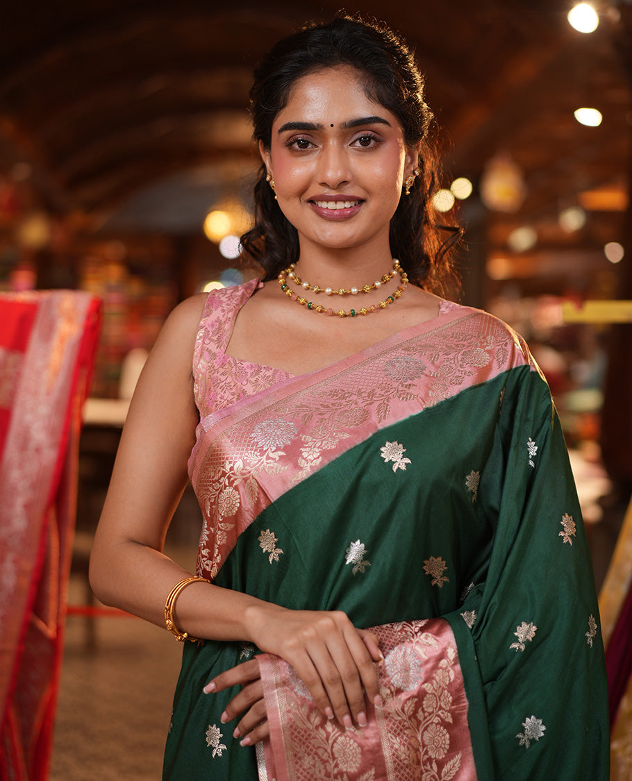 Bottle Green Mushuru Silk Saree, Enriched with Zari Buttas All Over Its Body, Complemented by Captivating Contrast Border of Floral Jaal Designs, Grandly Decked Up Pallu and Paired with a Contrast Blouse