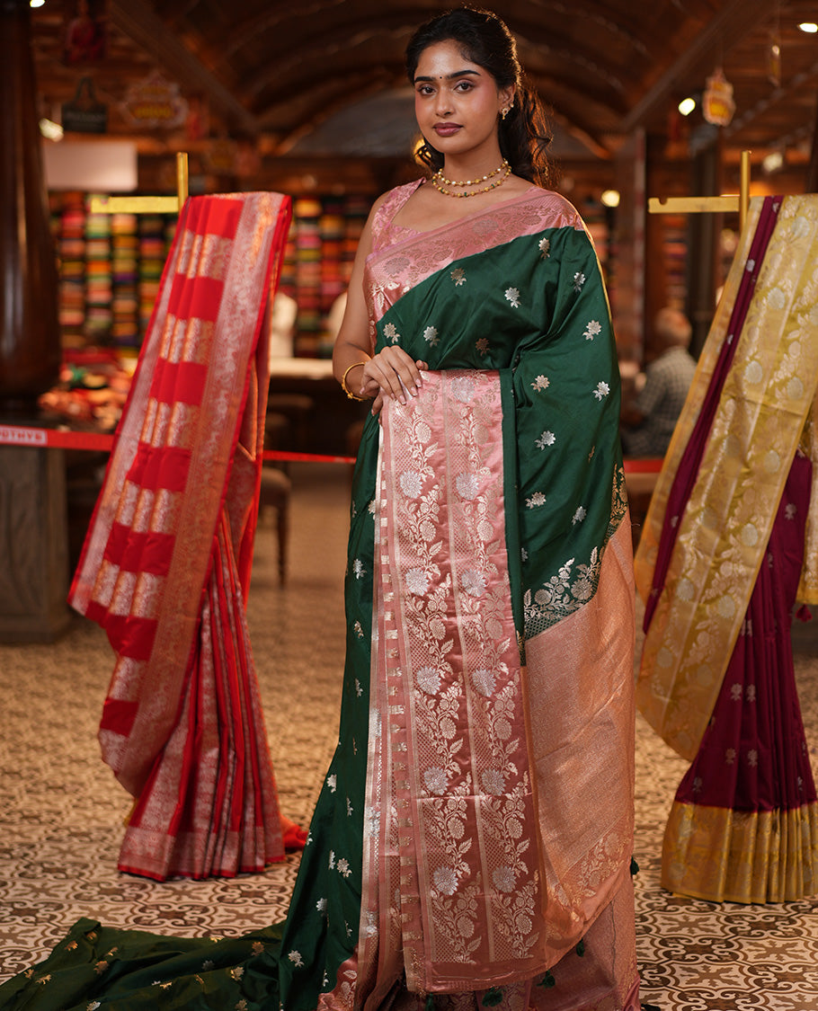 Bottle Green Mushuru Silk Saree, Enriched with Zari Buttas All Over Its Body, Complemented by Captivating Contrast Border of Floral Jaal Designs, Grandly Decked Up Pallu and Paired with a Contrast Blouse