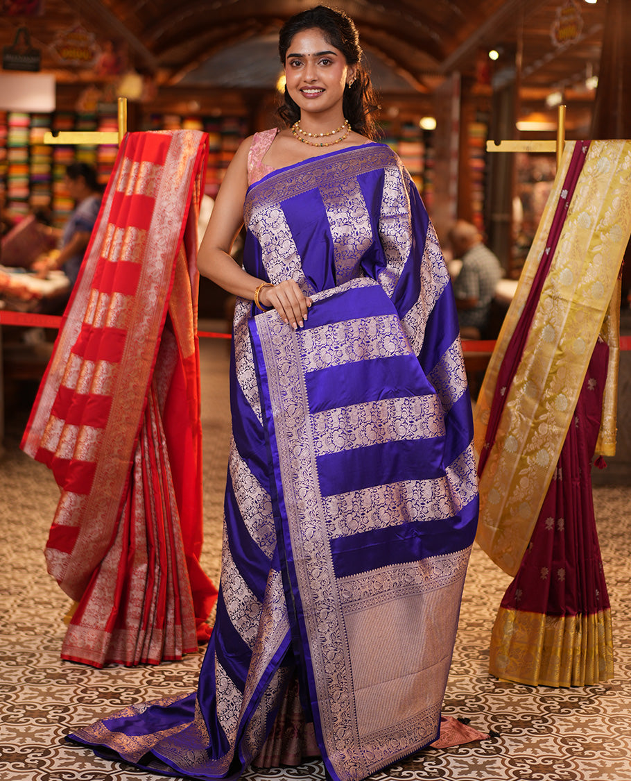 Blue Mushuru Silk Saree, Elegantly Decked Up with Vertically Woven Flora-Fauna Zari Designs On Its Body, Highlighted by Zari Border of Peacock and Deer Motifs, Grand Pallu, and Paired with a Plain Blouse