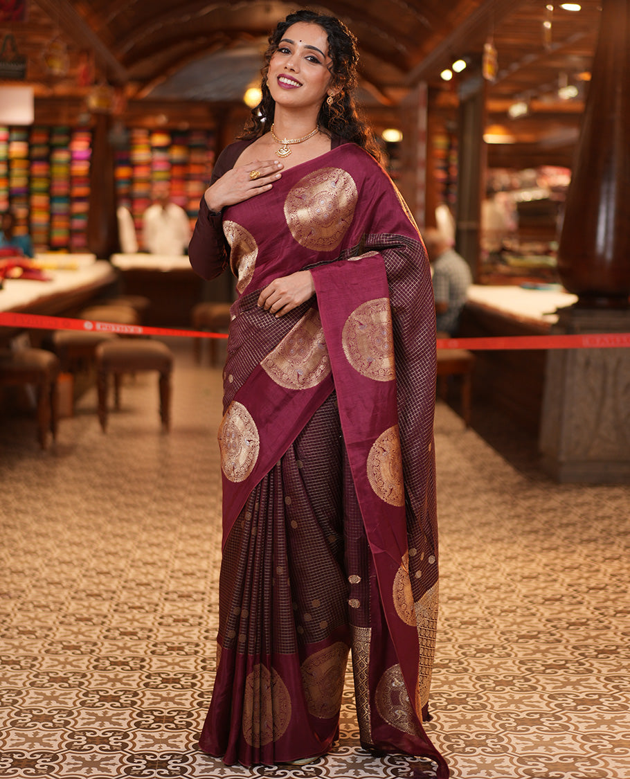Coffee Maroon H O-Silk Saree, Richly Detailed with Zari Buttas and Zari Checks On Its Body, Accentuated with Contrast Big Chakram Motifs Woven Border, Grand Jaal Design Woven Pallu, and Paired with a Checked Blouse