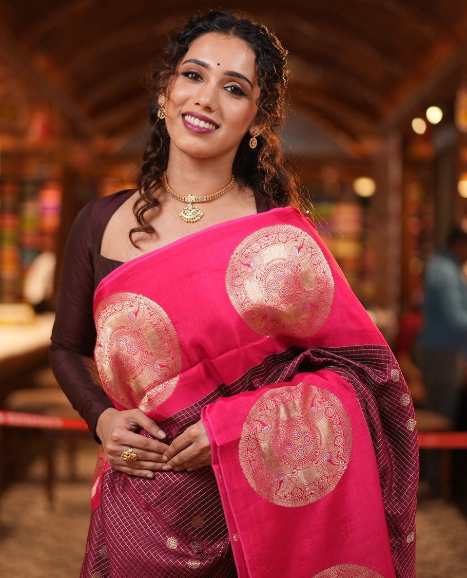 Maroon H O-Silk Saree, Elegantly Detailed with Zari Buttas and Zari Checks On Its Body, Accentuated with Contrast Big Chakram Motifs Woven Border, Grand Jaal Design Woven Pallu, and Paired with a Checked Blouse