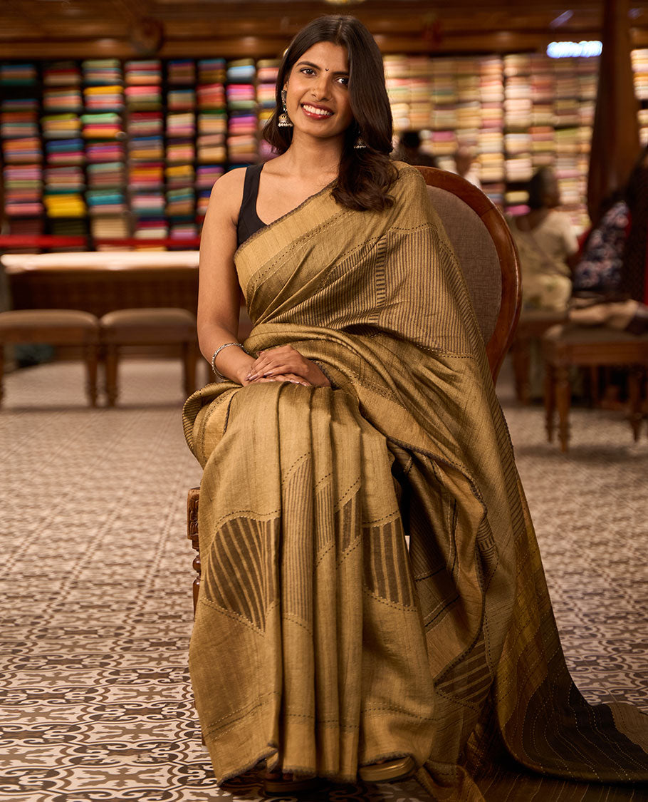 Light brown abstract design tussar silk saree with contrast plain border & striped pallu