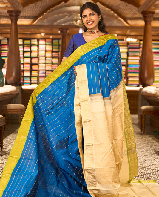 Blue striped kancheepuram silk saree with contrast ganga jamuna, korvai border of ara madam design & ogee design pallu