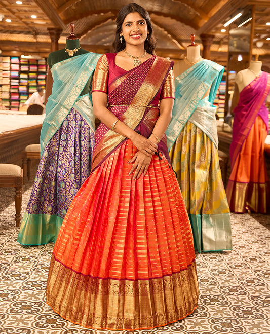 Orange striped readymade silk half saree with contrast intricate zari design border, floral design blouse & floral design dhavani