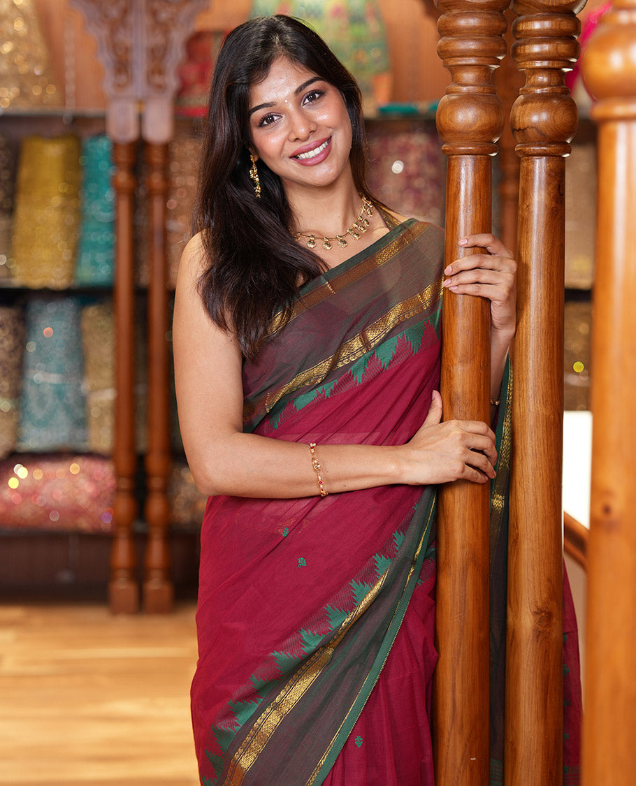 Maroon Chettinad Cotton Saree, Subtly Sparkled with Thread Buttas All Over Its Body, Complemented by a Contrast Border Rettai Pettu Border of Paisley and Chevron Stripes, Subtly Designed Pallu, and Paired with a Matching Blouse