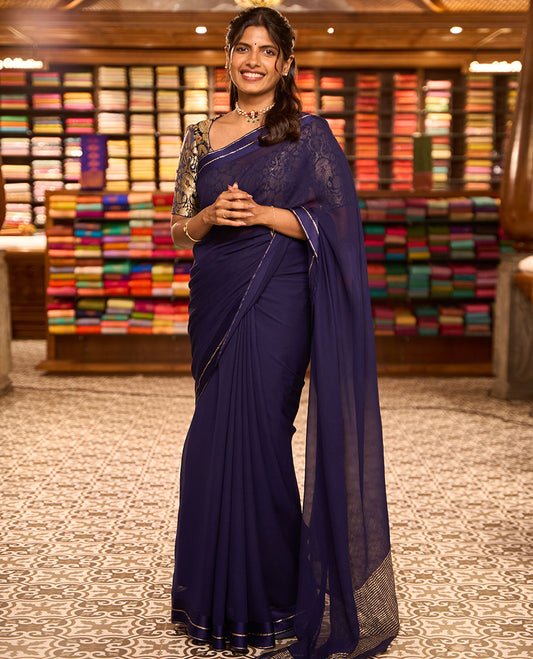 Navy blue plain design pure chiffon saree, zari border of neli kathir design, and pallu steeped with zari stripes