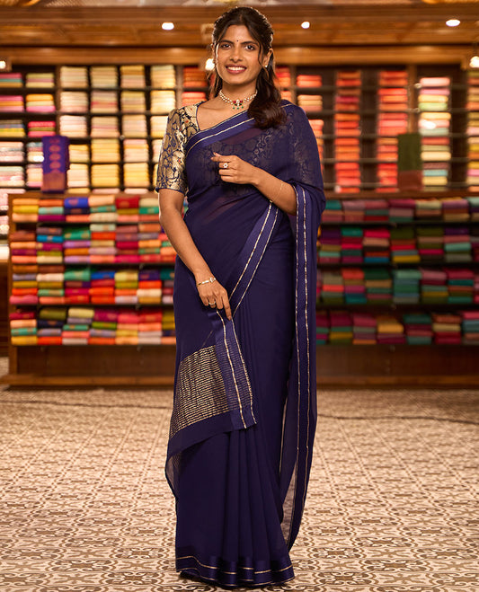 Navy blue plain design pure chiffon saree, zari border of neli kathir design, and pallu steeped with zari stripes