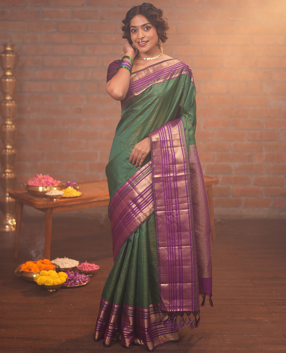 Green and Magenta Vasundhara Silk Saree, Enriched with Veldhari and Muthu Stripes On Its Body, Complemented by Contrast Border of Muthu, Lavangam, Neli, Mayil Kann, And Mayil Designs, Grand Pallu, and Paired with a Contrast Blouse
