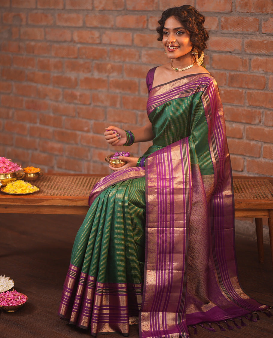 Green and Magenta Vasundhara Silk Saree, Enriched with Veldhari and Muthu Stripes On Its Body, Complemented by Contrast Border of Muthu, Lavangam, Neli, Mayil Kann, And Mayil Designs, Grand Pallu, and Paired with a Contrast Blouse