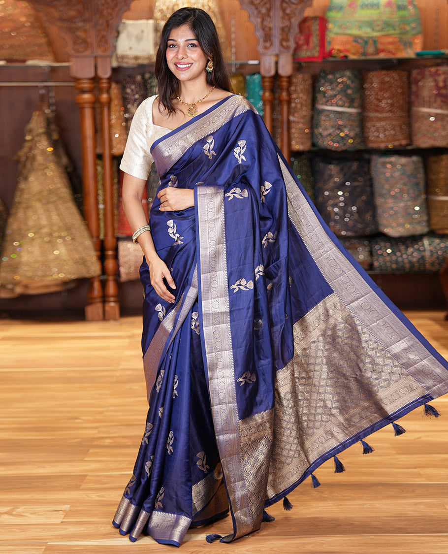 Navy Blue Semi-Banaras Satin Silk Saree, Dazzled with Floral Zari Buttas Across Its Body, Highlighted by Traditional Zari Design Border, Grand Zari Woven Palu of Jaal Designs, and Paired with a Matching Blouse