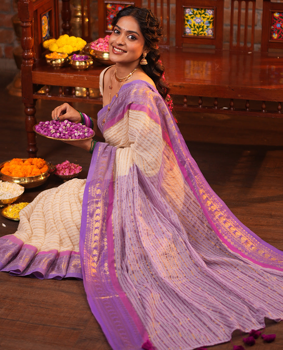 Cream Khadi Mul Cotton Saree, Adorned with Horizontal Stripes on Its Body, Complemented by a Contrast Traditional Zari Design Border, Zari Striped Pallu, and Paired with a Matching Blouse