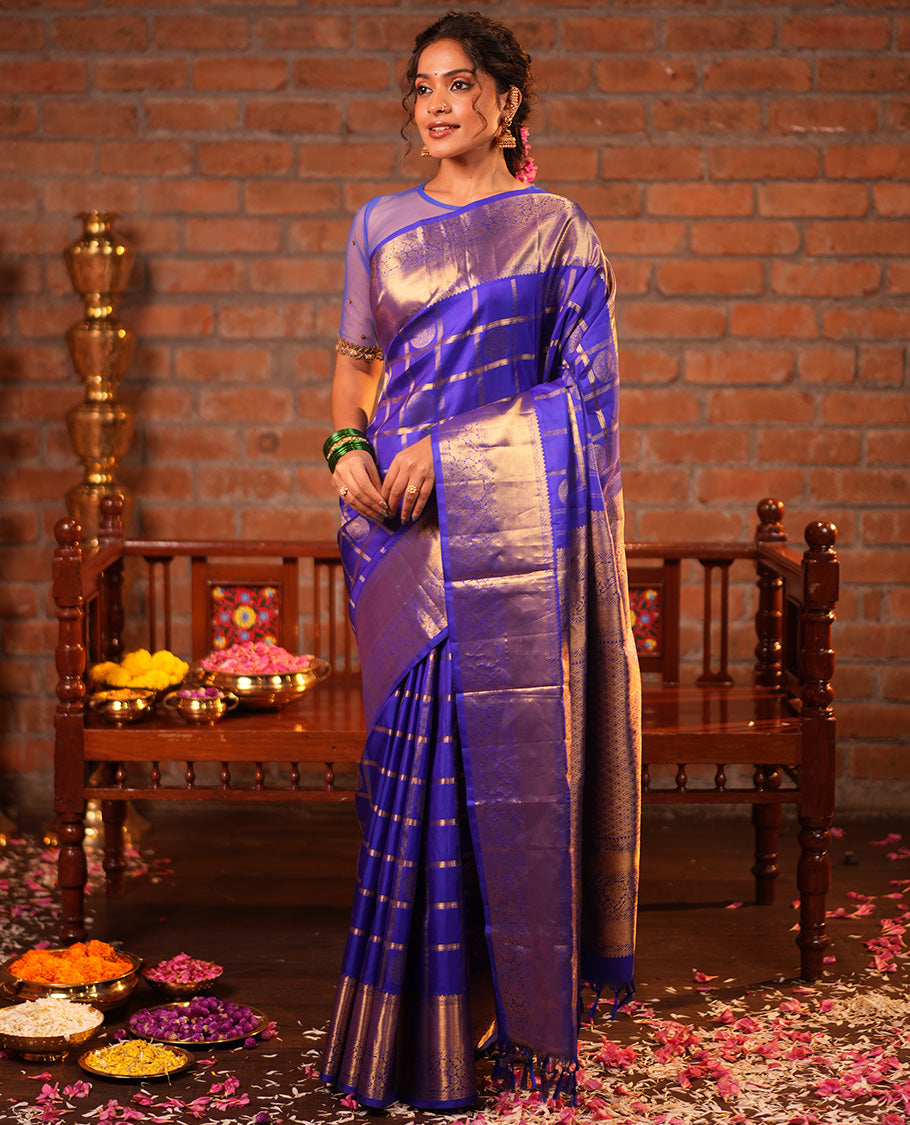 M.s Blue Vasundhara Silk Saree Features Zari Butta Enclosed Checks, a Zari Border of Mayil Kann and Kodi Visiry, Jaal Pallu, and Comes with a Matching Blouse