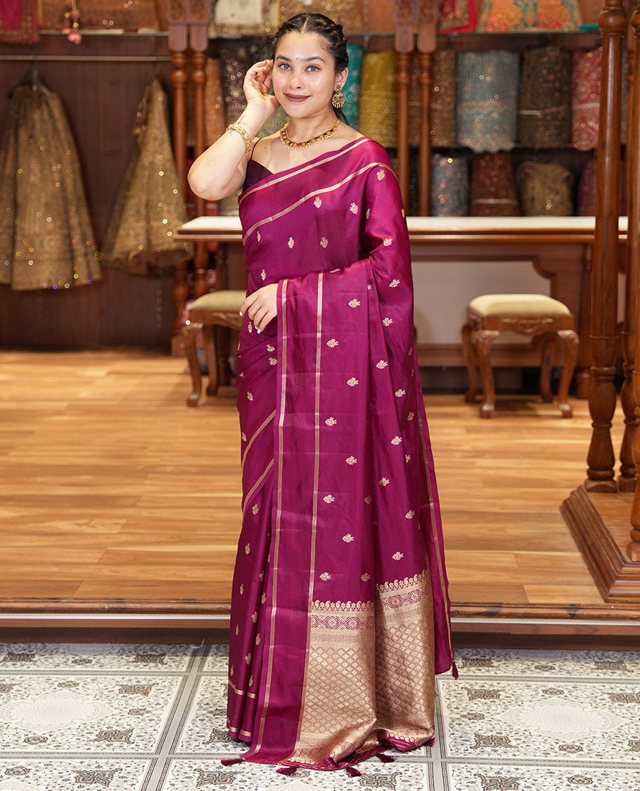 Magenta Pink Semi-Banaras Satin Silk Saree, Ornamented with Zari Buttas All Over Its Body, Highlighted by Zari Striped Border, Grand Jaal Pallu, and Paired with a Matching Blouse