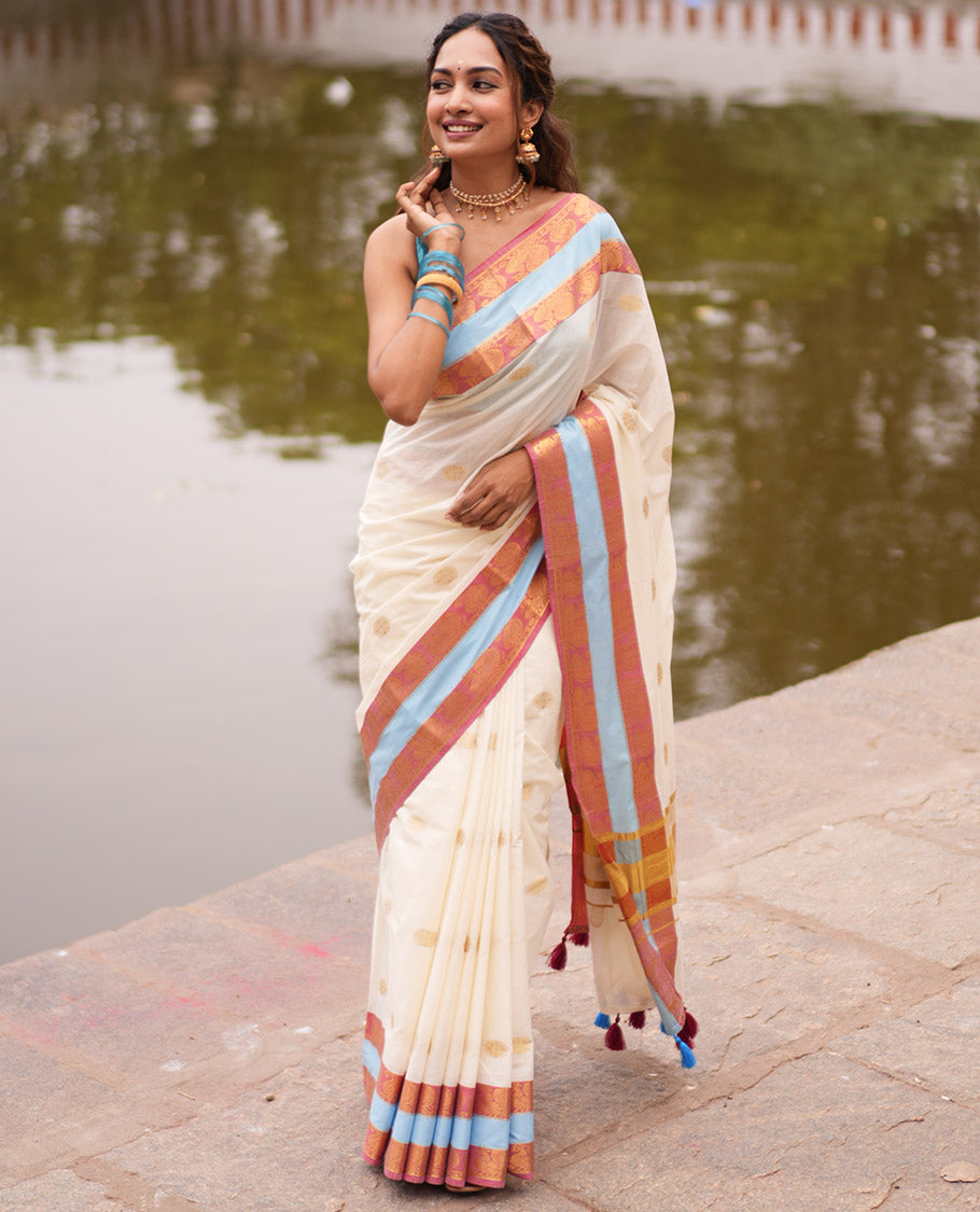 Cream Kerala Cotton Saree, Bedecked with Zari Buttas, Contrast Peacock-Paisley Border, a Matching Blouse