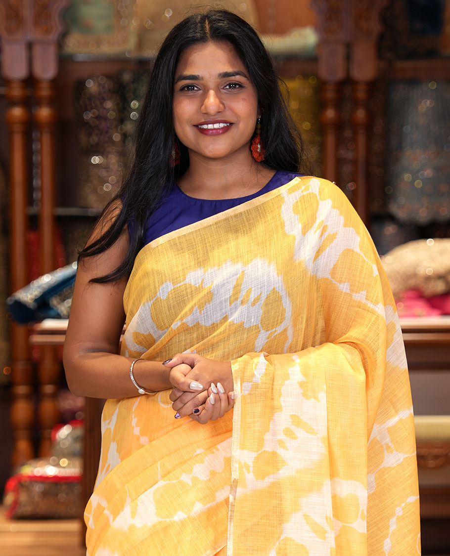 Borderless Yellow Linen Cotton Saree, Decked Up with Shibori Printed on Its Body, Complemented by Contrast Floral Printed Pallu, and Paired with a Contrast Floral Printed Blouse