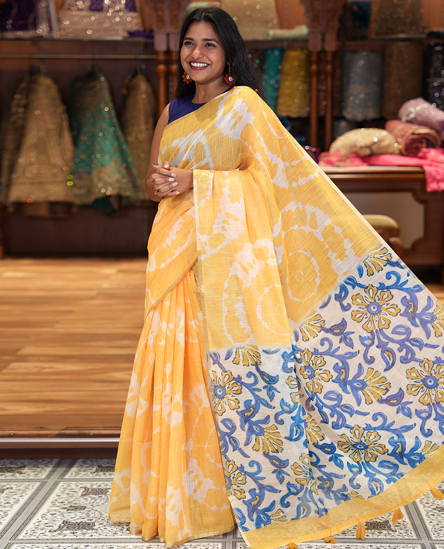 Borderless Yellow Linen Cotton Saree, Decked Up with Shibori Printed on Its Body, Complemented by Contrast Floral Printed Pallu, and Paired with a Contrast Floral Printed Blouse