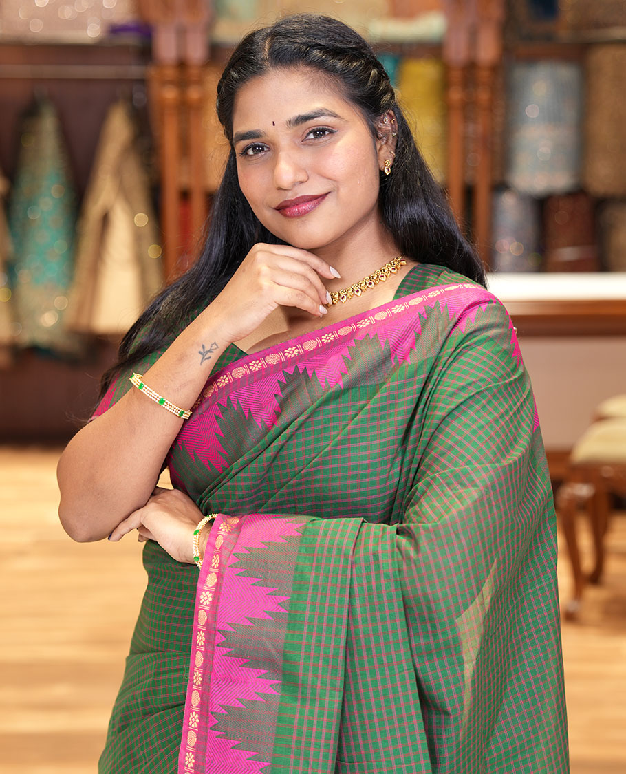 Green Chettinad Cotton Saree, Decked Up with a Checked Design on Its Body, Complemented by a Contrast Temple Border, Subtly Striped Pallu, and Paired with a Matching Blouse