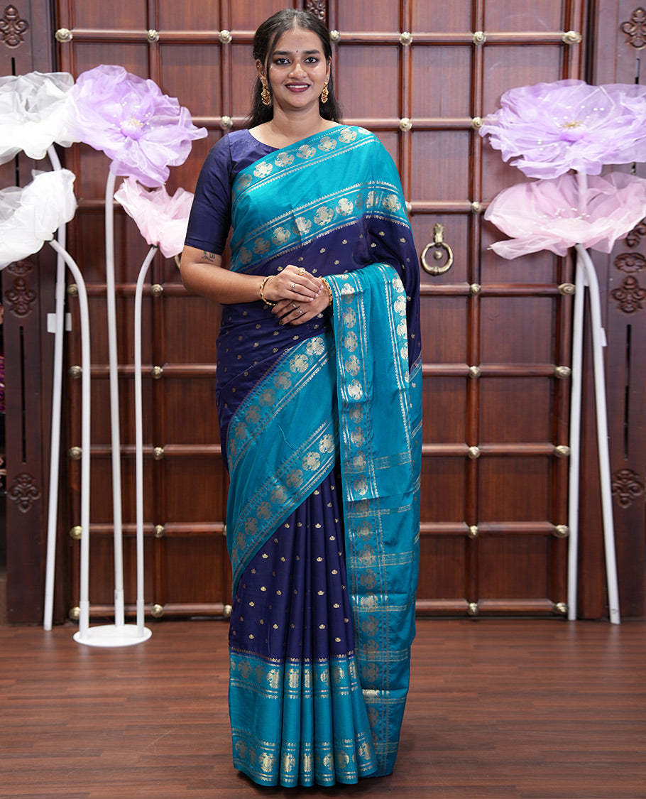 Navy Blue Art Mysore Silk Saree, Elevated with Zari Buttas All Over Its Body, Complemented by a Contrast Rettai Pettu Border of Two-Headed Eagle Designs, Pallu Steeped with Buttas and Stripes, and Paired with a Contrast Blouse