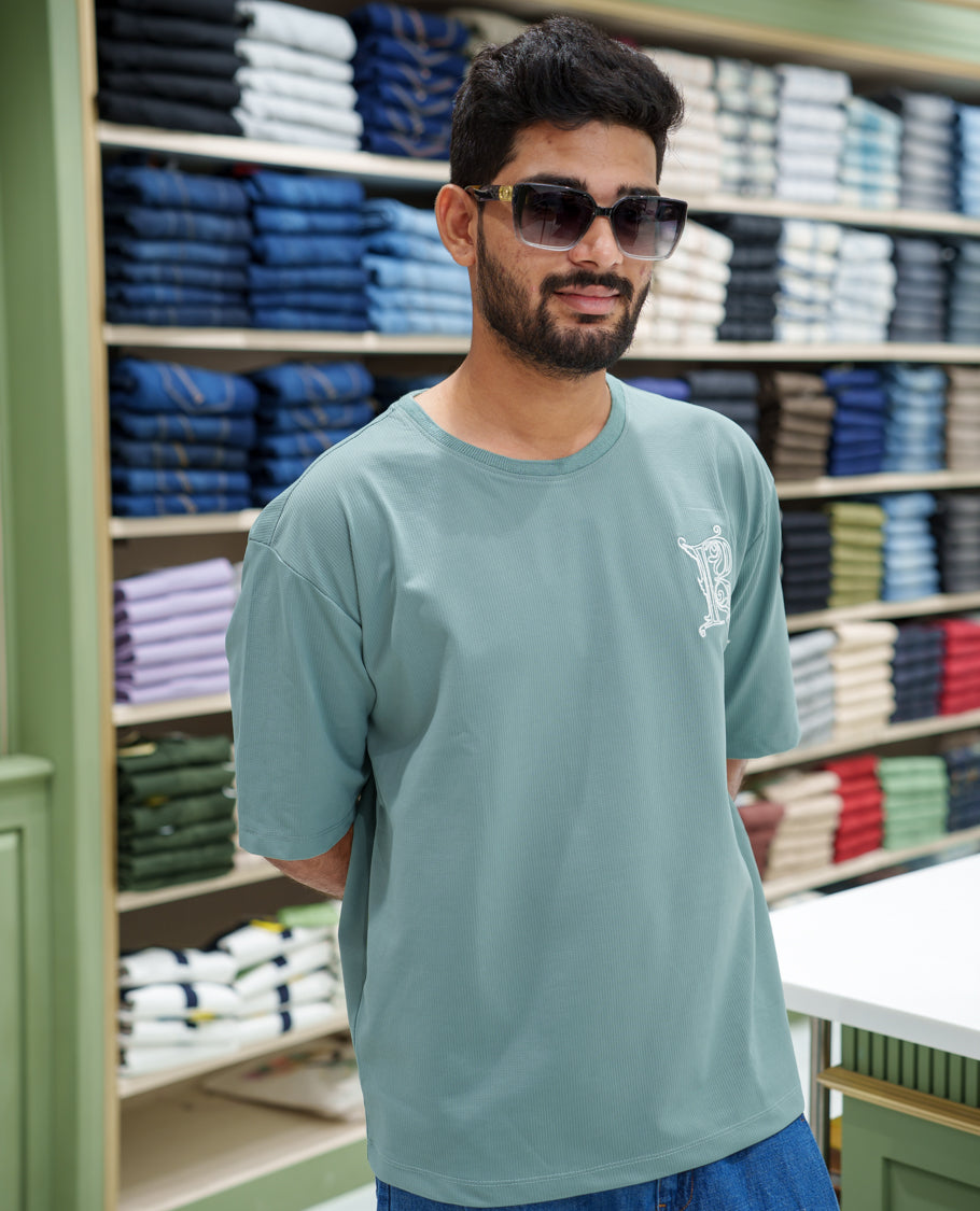 Teal Cotton-Blended T-shirt, Comes with a Unique Back Print, Half-sleeves, Crew Neck, Oversized Fit, and Regular Length