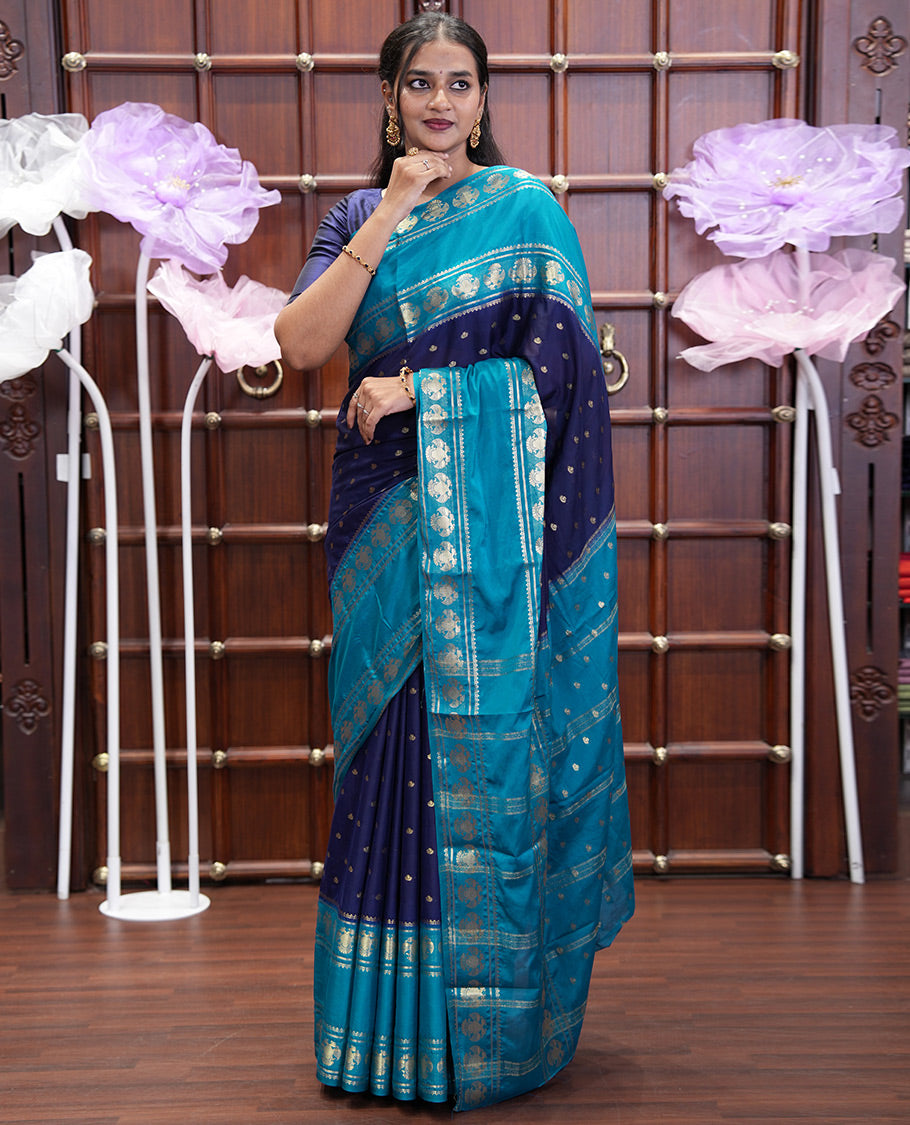 Navy Blue Art Mysore Silk Saree, Elevated with Zari Buttas All Over Its Body, Complemented by a Contrast Rettai Pettu Border of Two-Headed Eagle Designs, Pallu Steeped with Buttas and Stripes, and Paired with a Contrast Blouse