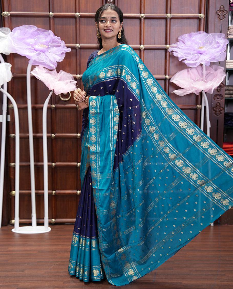 Navy Blue Art Mysore Silk Saree, Elevated with Zari Buttas All Over Its Body, Complemented by a Contrast Rettai Pettu Border of Two-Headed Eagle Designs, Pallu Steeped with Buttas and Stripes, and Paired with a Contrast Blouse