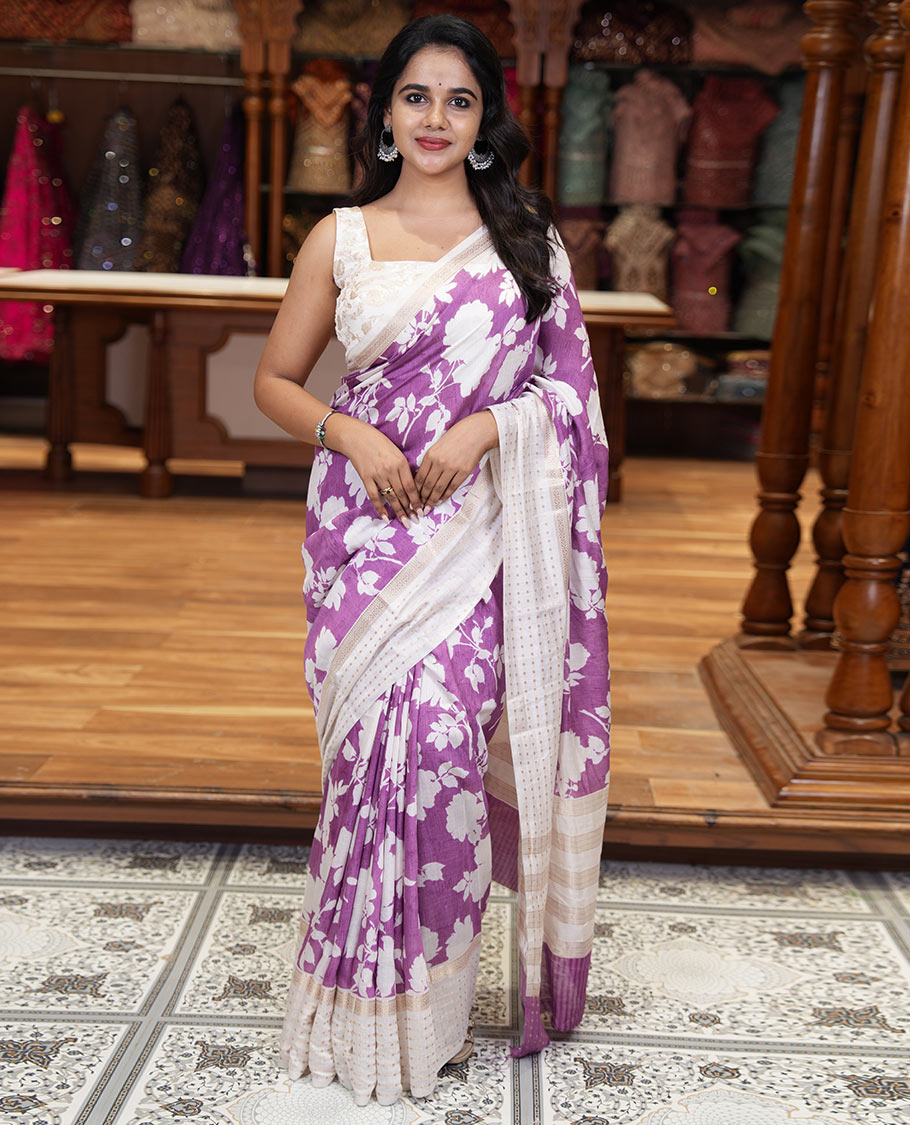Lavender silhouette-style floral discharge printed Assam silk saree, contrast traditional zari border of rudraksham motifs, zari striped pallu, and a floral printed blouse