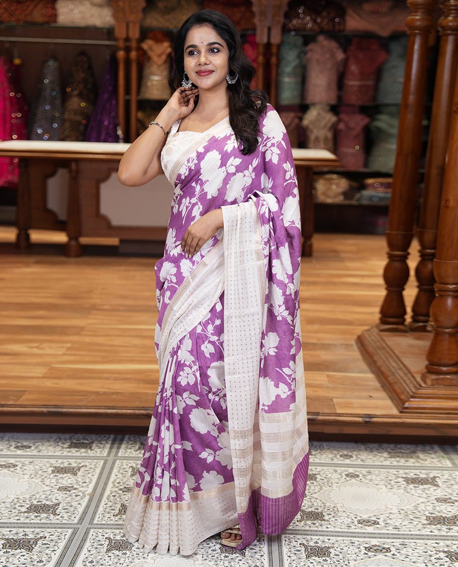 Lavender silhouette-style floral discharge printed Assam silk saree, contrast traditional zari border of rudraksham motifs, zari striped pallu, and a floral printed blouse