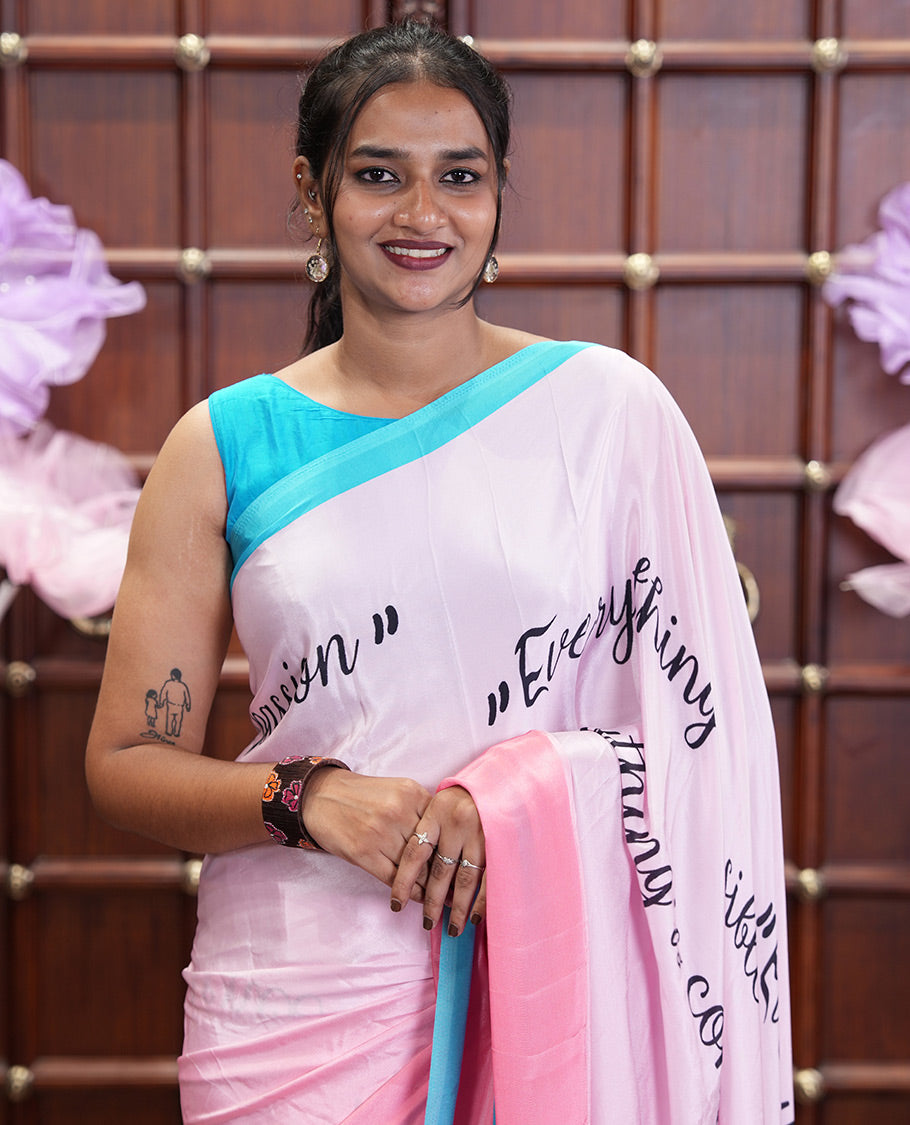 Pink Satin Crepe Saree, Uniquely Printed with Calligraphy Print, Complemented by Contrast Border, Pallu of Human Figurines Print, and Paired with a Contrast Blouse