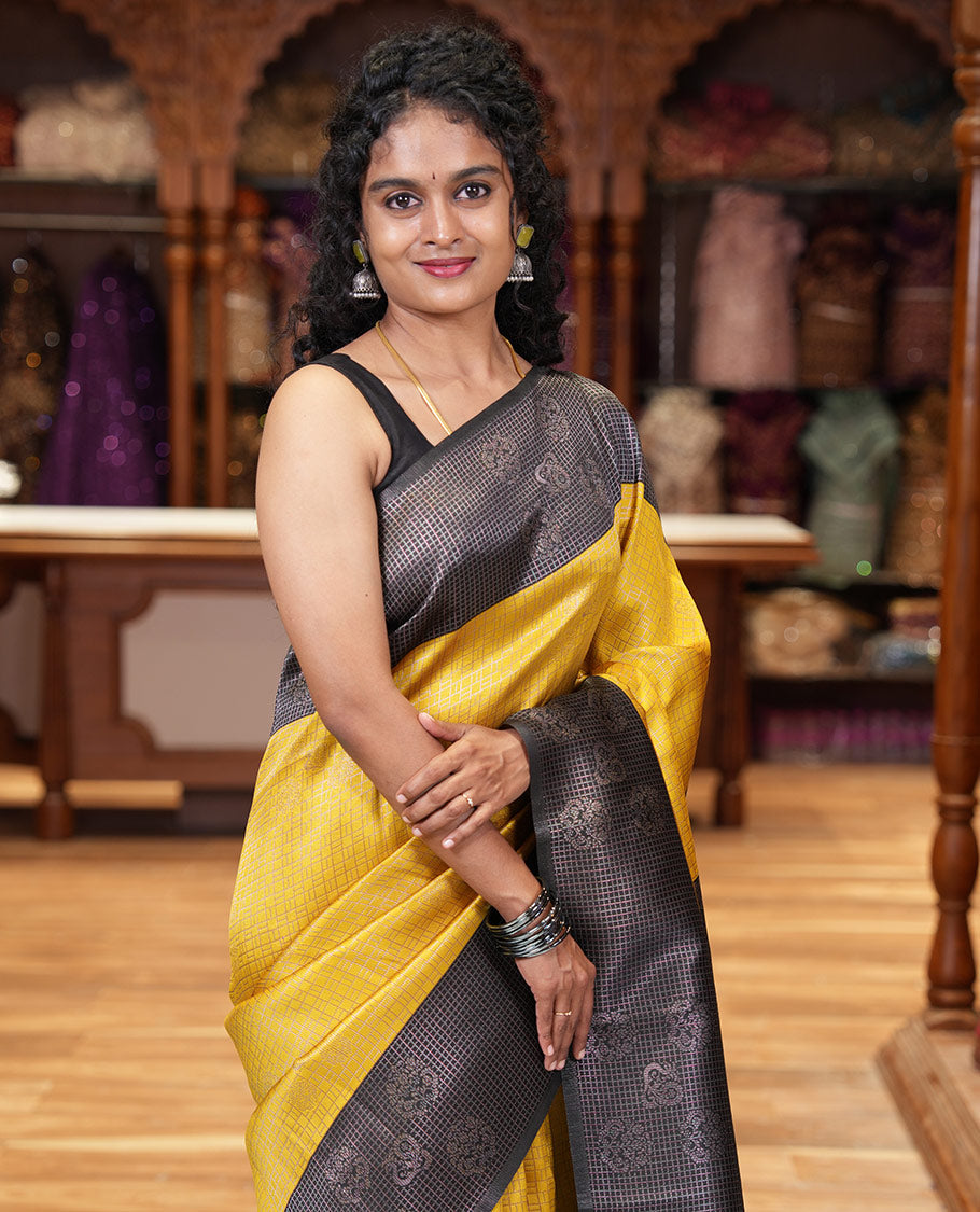 Yellow zari buttas and checked kanchi silk saree, contrast border of zari buttas, and checks, intricate pallu, and contrast zari bordered blouse