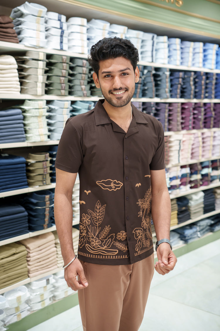 Brown Cotton-Blended Casual Shirt Comes with a Tropical Floral Embroidery, a Cuban Collar Neck, Half Sleeves, a Regular Fit, and Regular Length