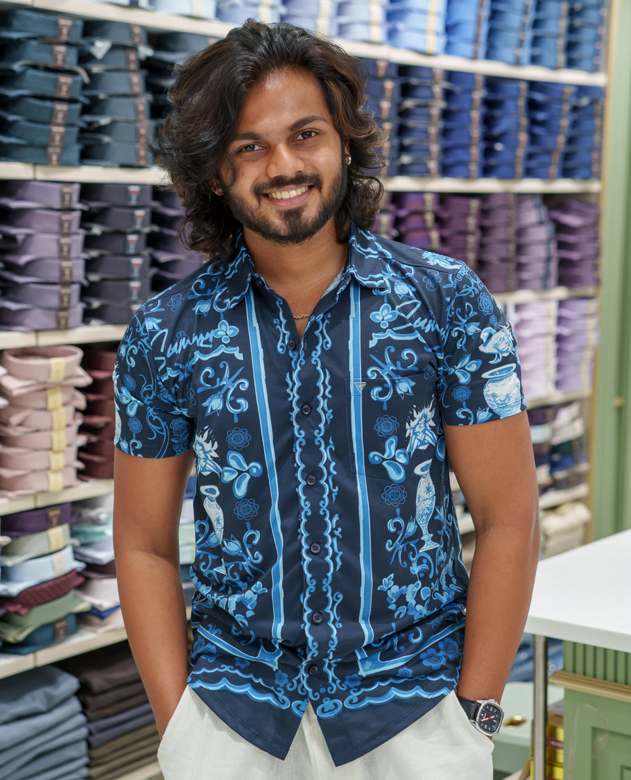Navy Blue Cotton-Blended Casual Shirt Comes with Floral-Flower Vase Motifs Print, Spread Collar, Half Sleeves, Regular Fit, and Regular Length