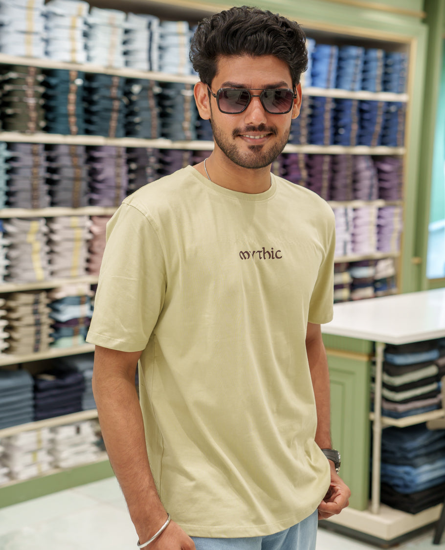 Cream Cotton-Blended T-Shirt Comes with an Deer-Motifs Back Print, Crew Neck, Half Sleeves, Oversized Fit, and Regular Length