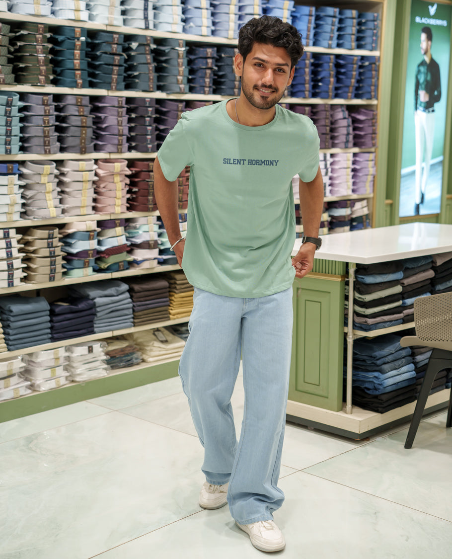 Green Cotton-Blended T-Shirt Comes with an Tree-Motifs Back Print, Crew Neck, Half Sleeves, Oversized Fit, and Regular Length