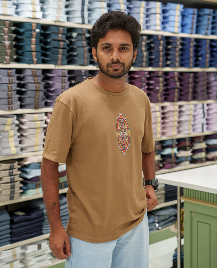 Brown Cotton-Blended T-Shirt Comes with an Evil-Themed Back Print, Crew Neck, Half Sleeves, Oversized Fit, and Regular Length